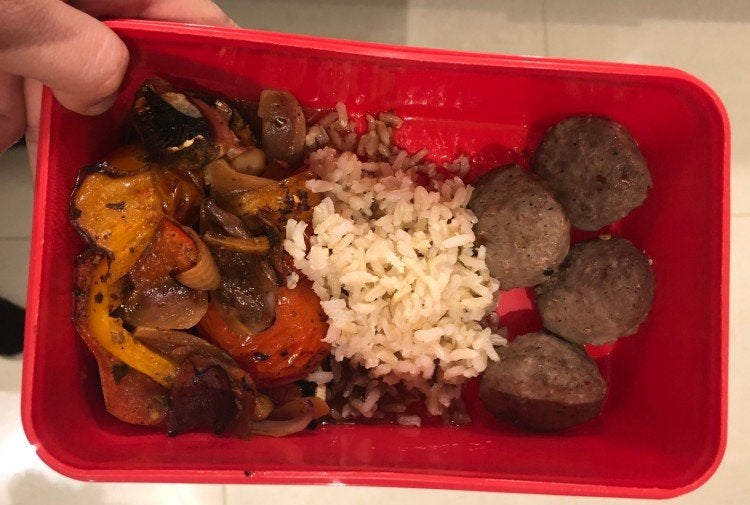 Meal prep box of beef meatballs, brown rice and grilled vegetables