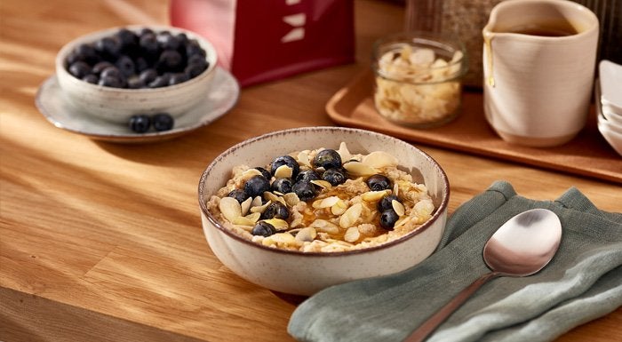Bowl of cereal with blueberries and flaked almonds