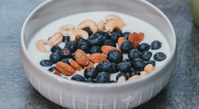 Bowl of yoghurt with blueberries, almonds and cashews