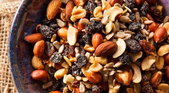 Bowl of trail mix with nuts, raisins and seeds