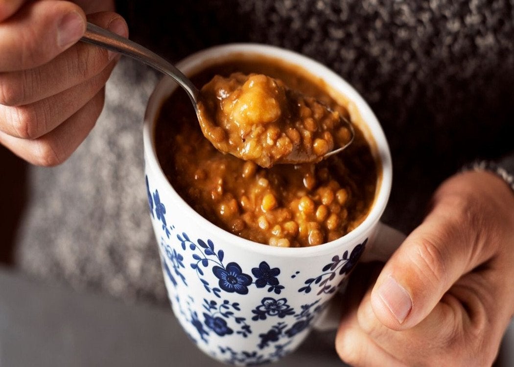 A man eating homemade soup out of a mug | Gillette UK
