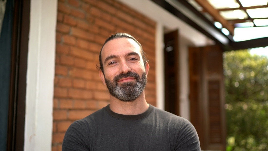 A man with his hair tied back sports a medium beard style | Gillette UK