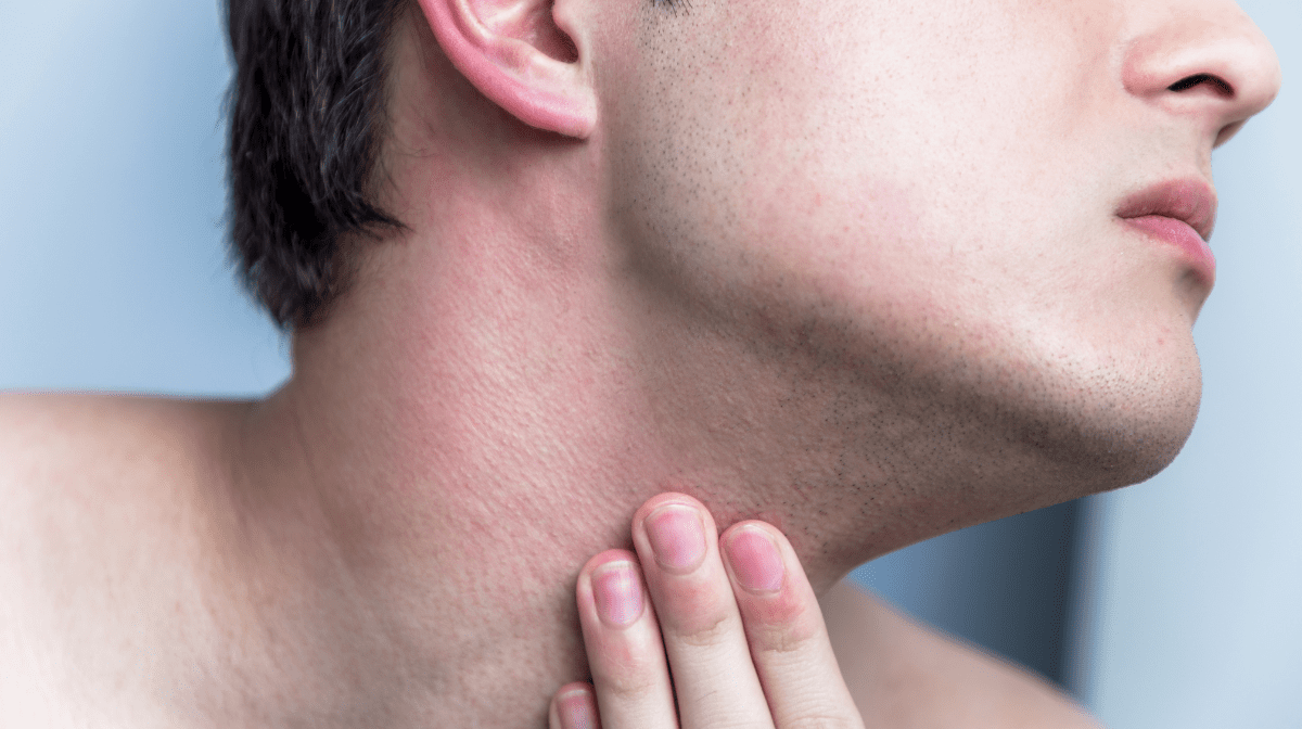 Close up of a man touching his sensitive neck | Gillette UK