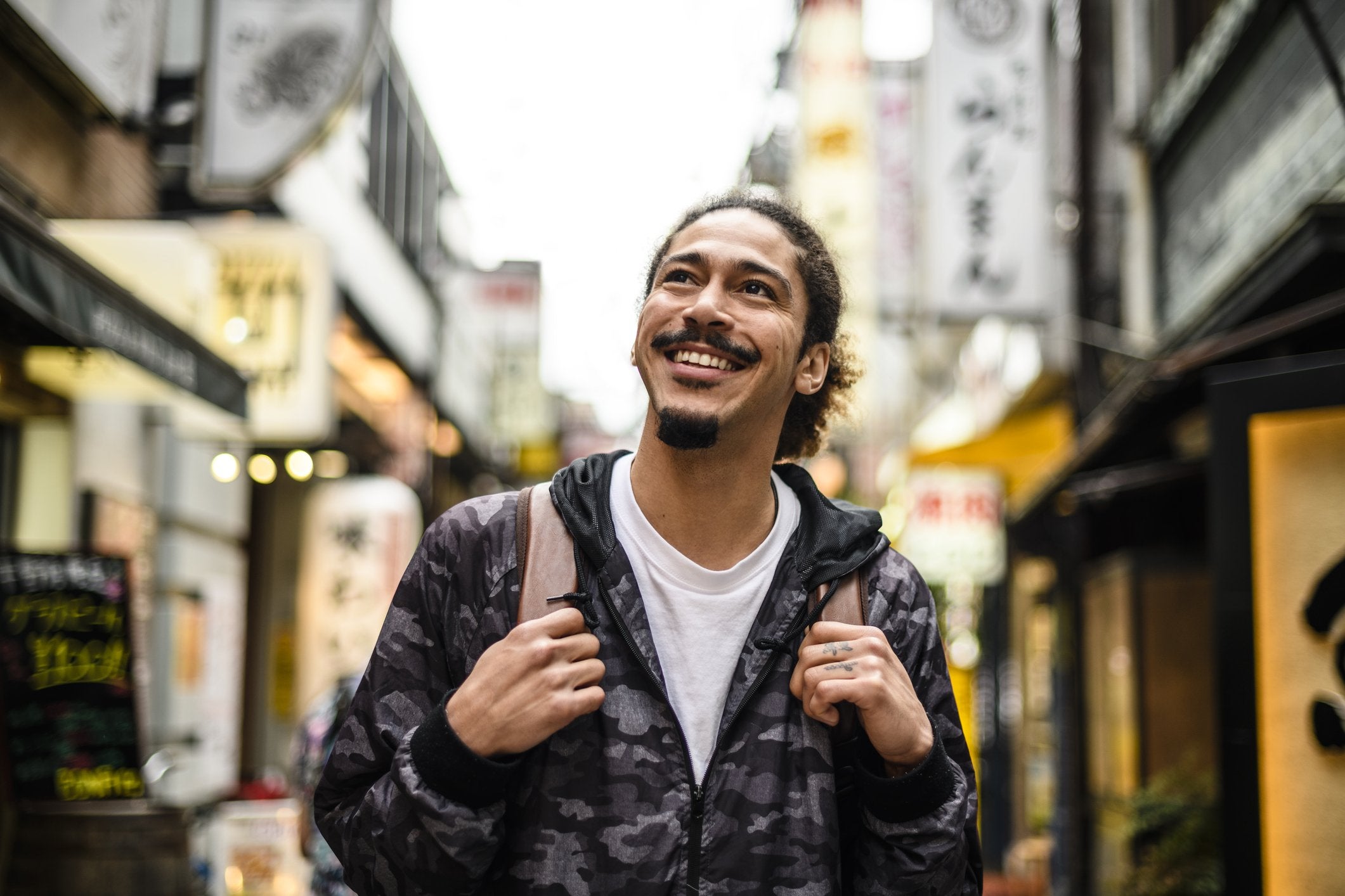 smiling man with goatee beard style