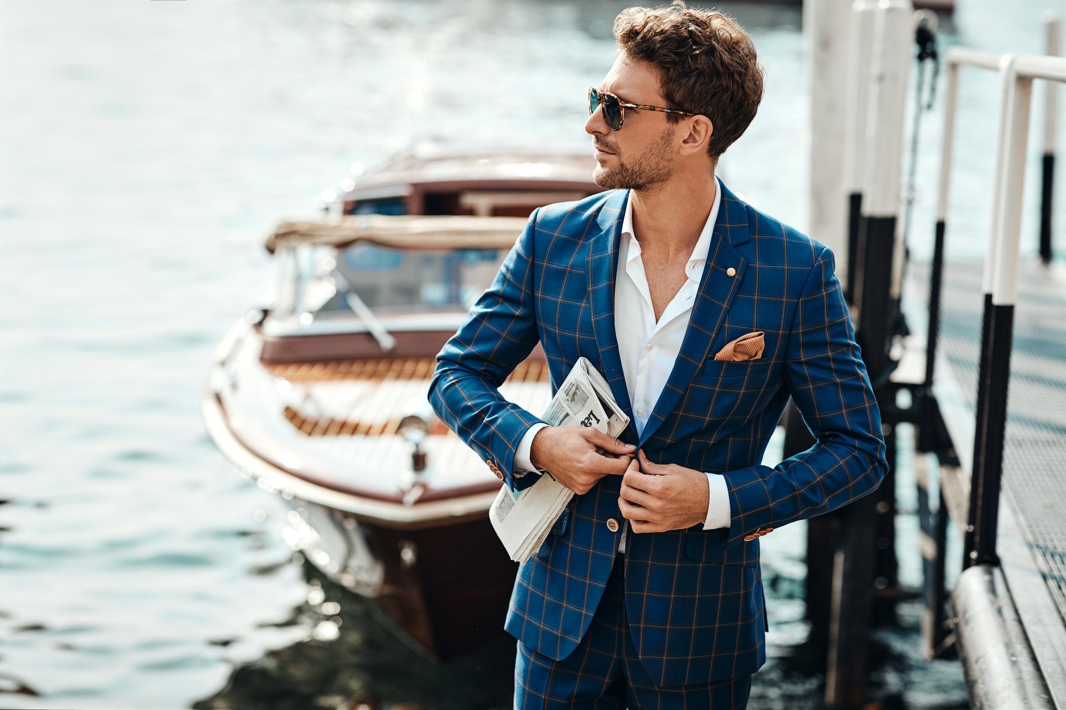 A smart man with a luxury grooming routine and suit, walks near the Venice canal | Gillette UK