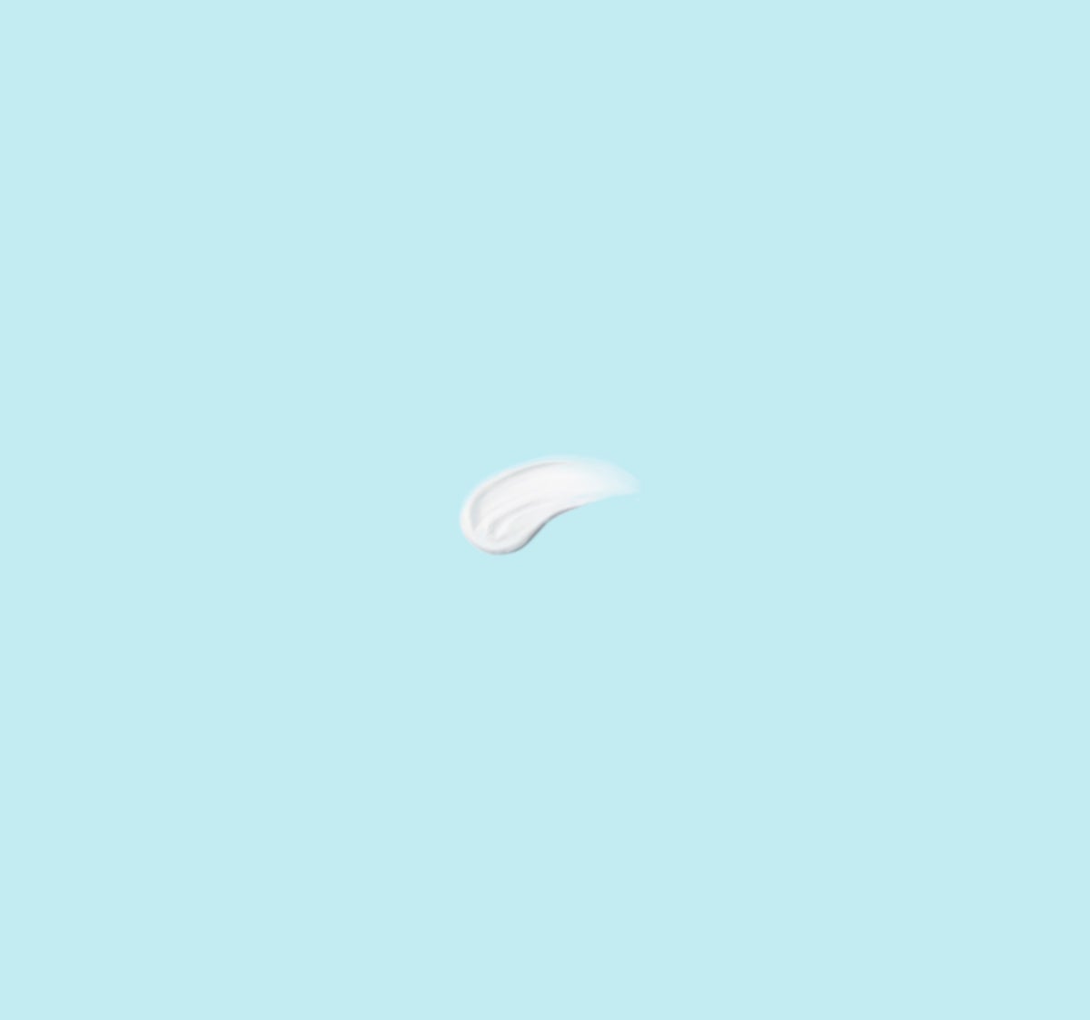 A smudge of white moisturiser against a pale blue background | Gillette Venus UK