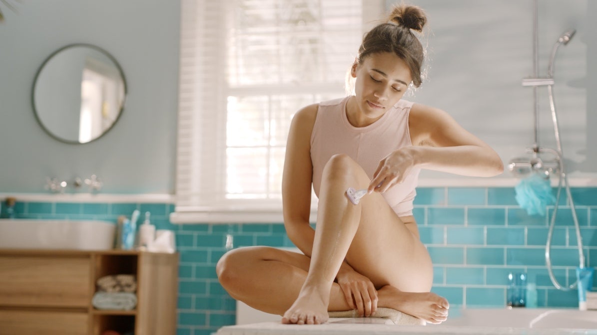 Women shaving with slow steady strokes in a bathroom | Gillette Venus UK