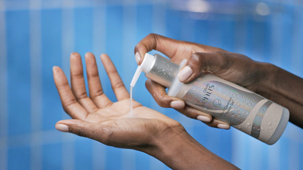 A woman squirts Satin Care cleansing gel onto her hand | Gillette Venus UK