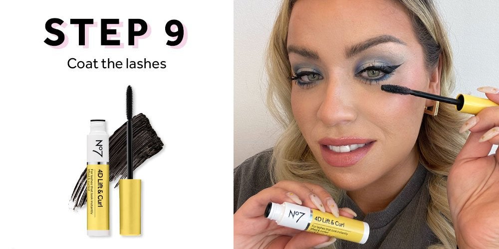 Woman applying mascara